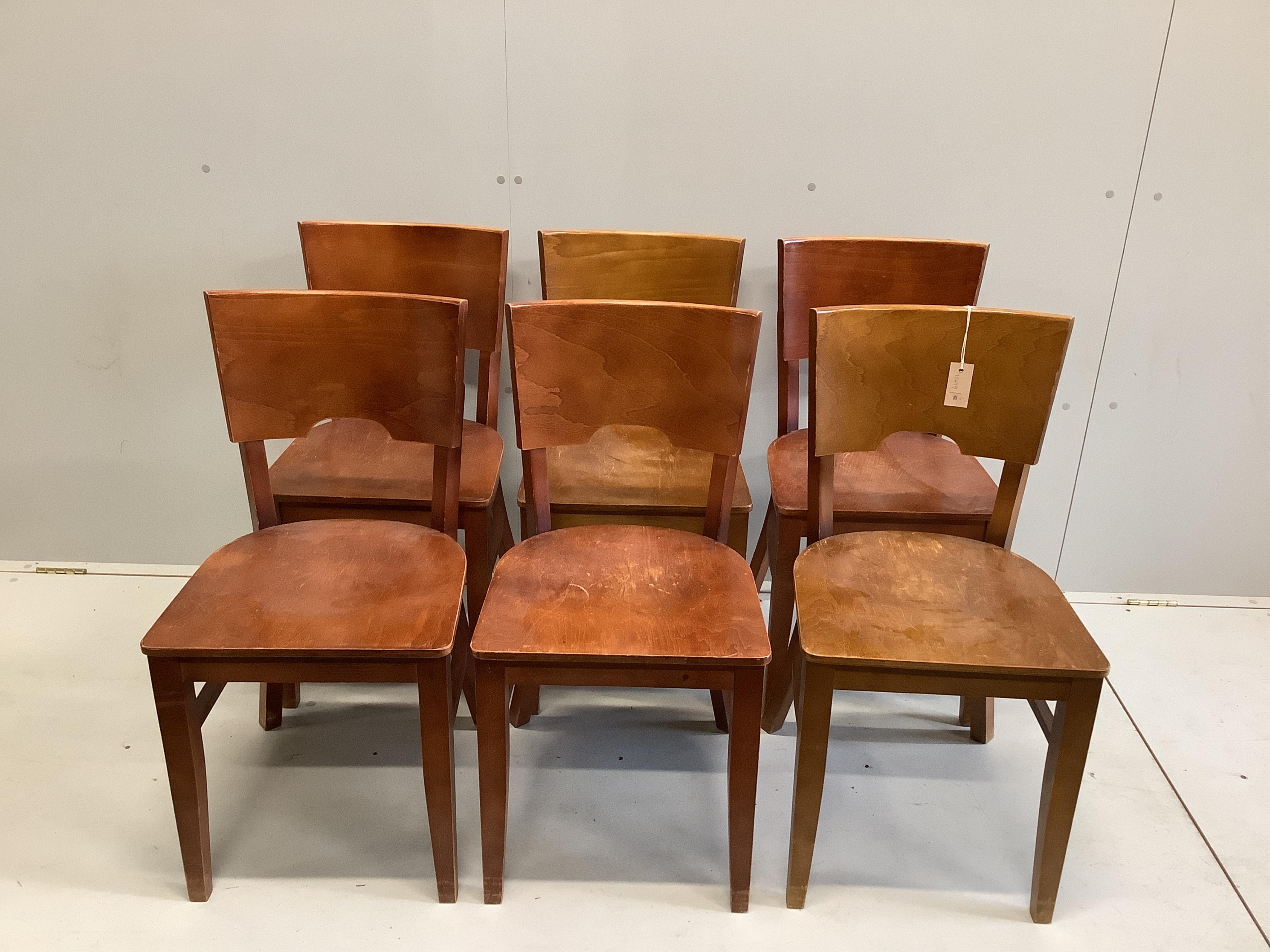 A mid century rectangular oak dining table with plank top, width 240cm, depth 84cm, height 74cm, together with a set of six beech dining chairs. Condition - fair